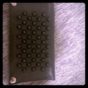 Black studded wallet with red inside. Real leather